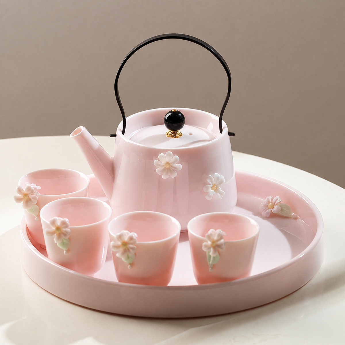 Blush pink floral ceramic gongfu tea set with teapot, five cups, and round tray