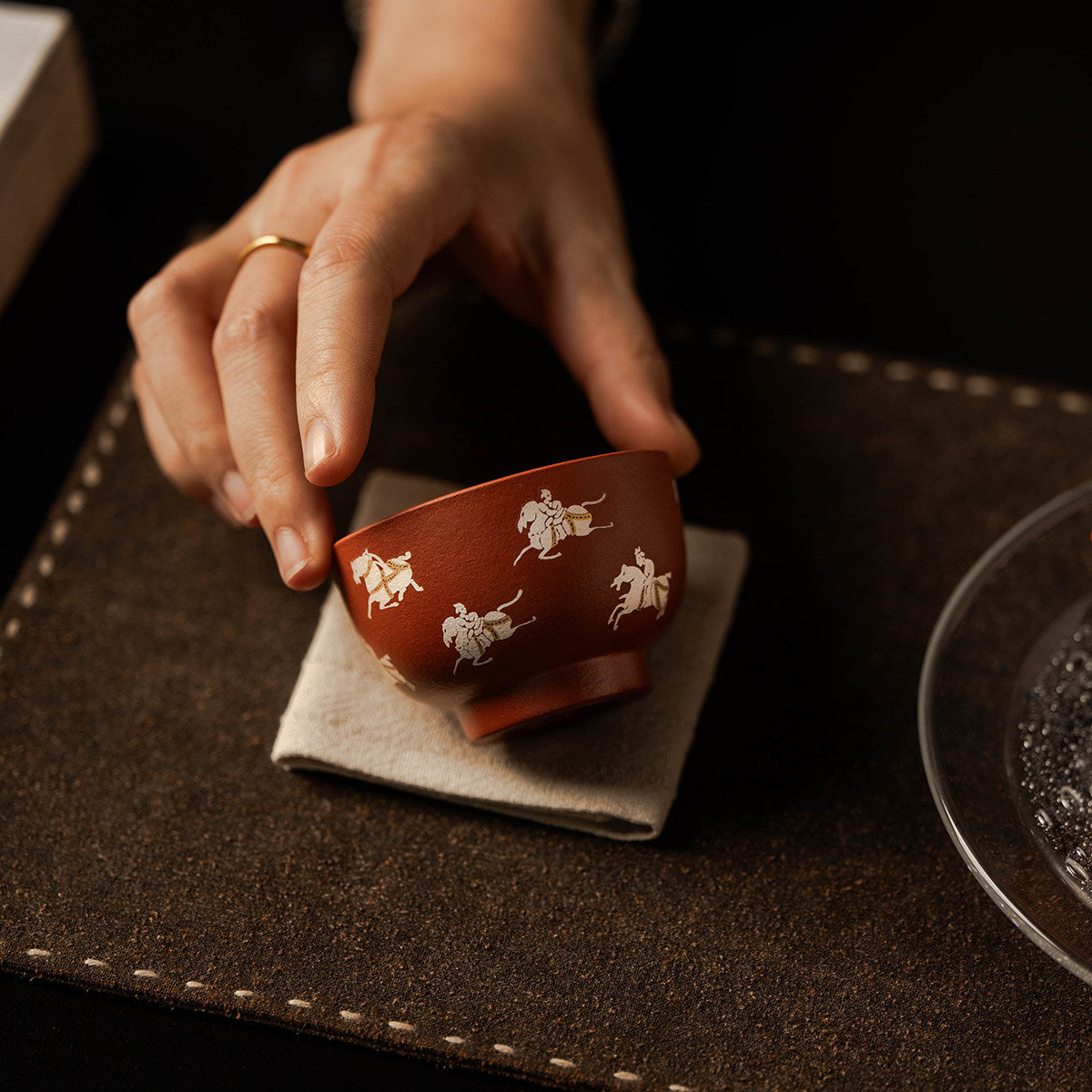 Zhu Ni clay master cup beside a tea tray during gongfu tea
