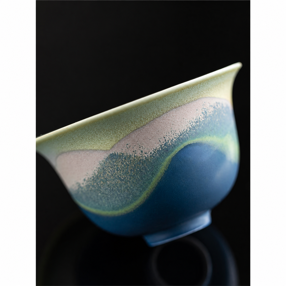 Close-up of layered blue green and pale pink mountain glaze