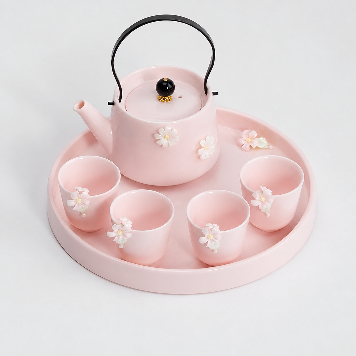 Blush pink floral tea set with teapot, four tall jasmine cups, and round tray